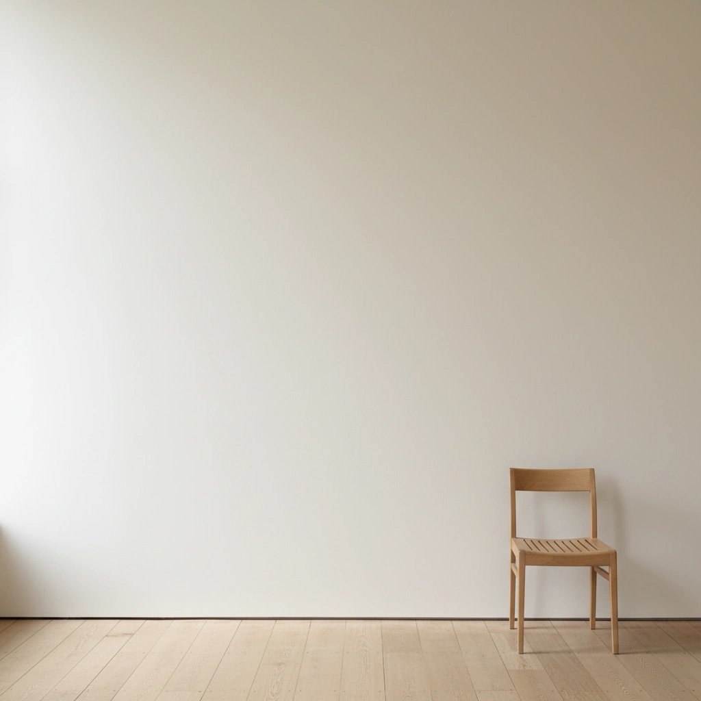 Wall art mockup: Minimalist gallery space with a wooden chair