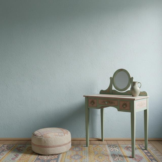 Eclectic bedroom with a dressing table and pouffe