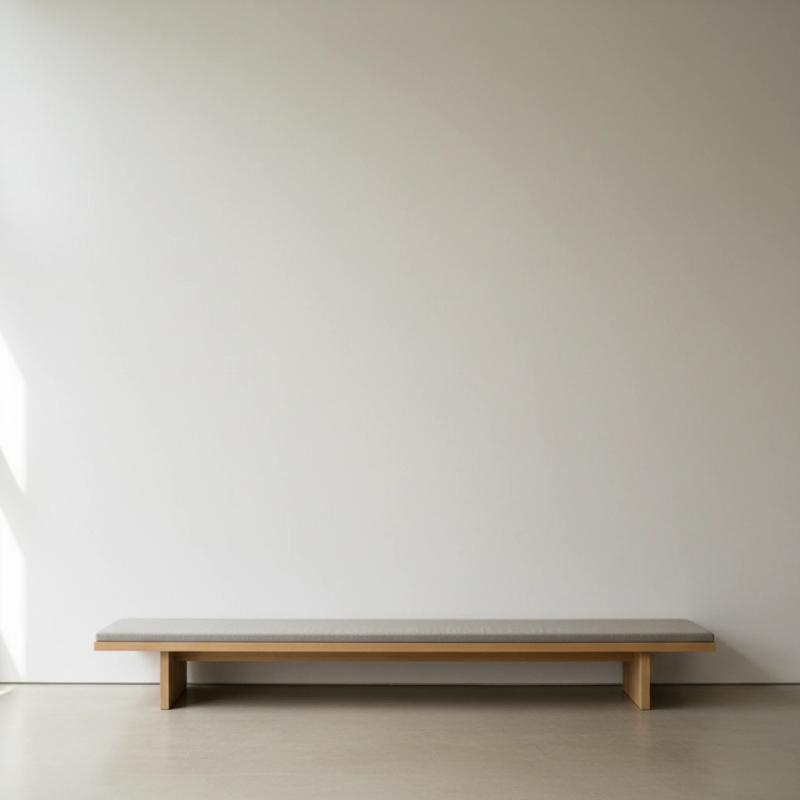 Minimalist gallery with a wooden bench