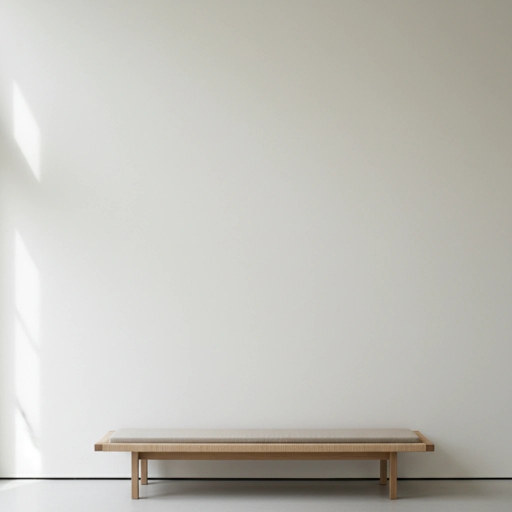 Wall art mockup: Minimalist gallery with a simple wooden bench