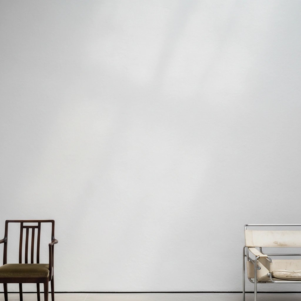 Wall art mockup: Minimalist gallery space with two chairs