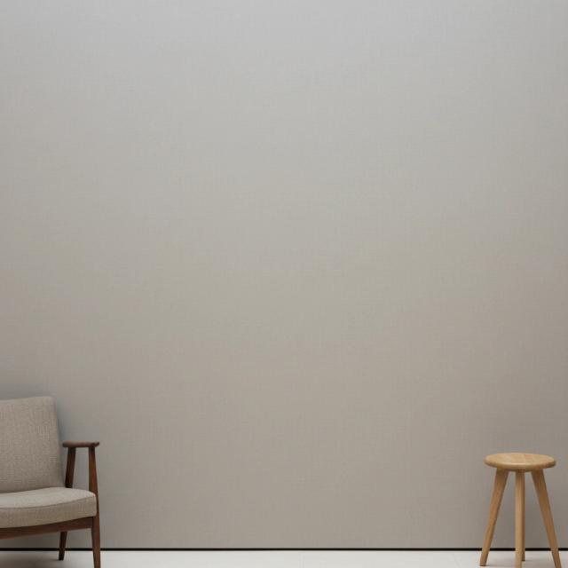 Minimalist gallery with an armchair and a wooden stool