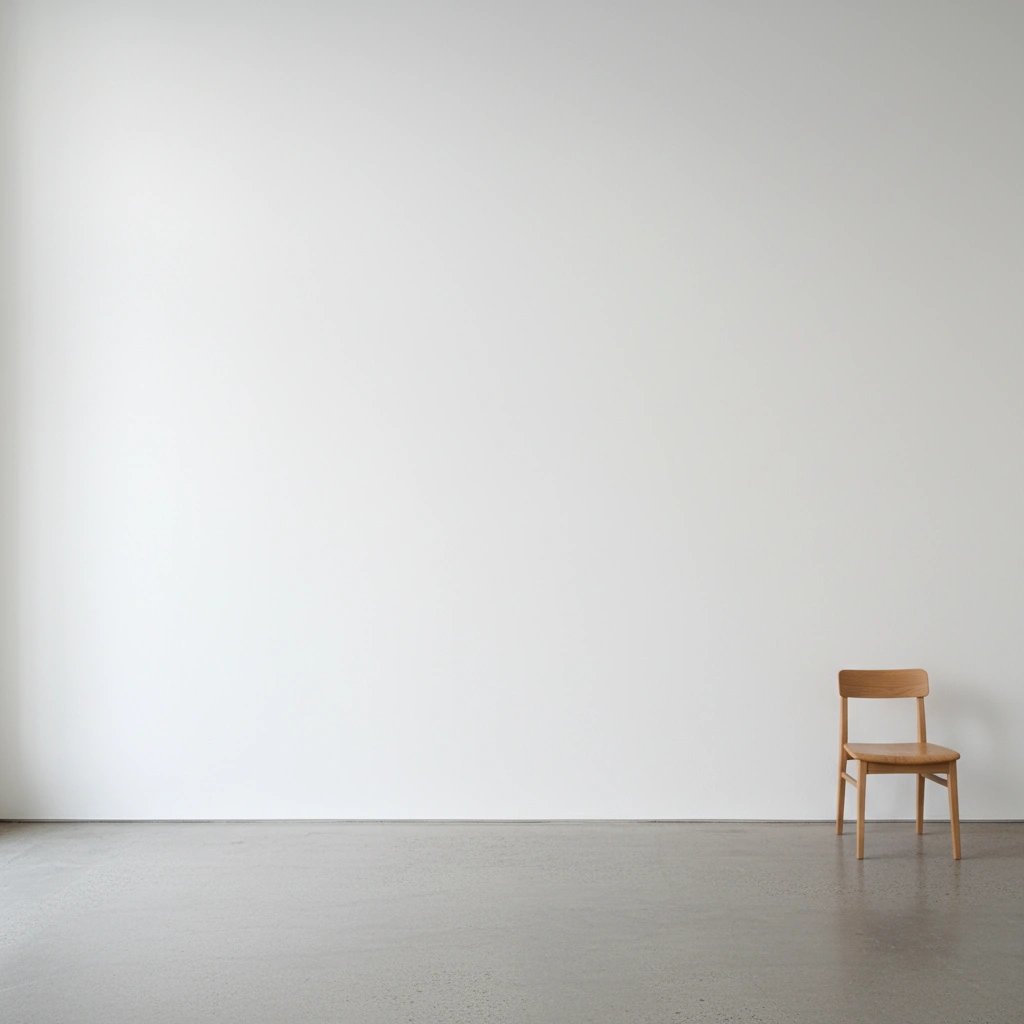 Wall art mockup: Minimalist gallery space with a single wooden chair