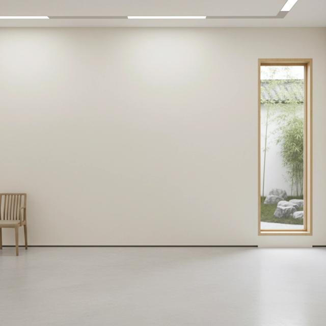 Minimalist gallery with a wooden chair and garden view