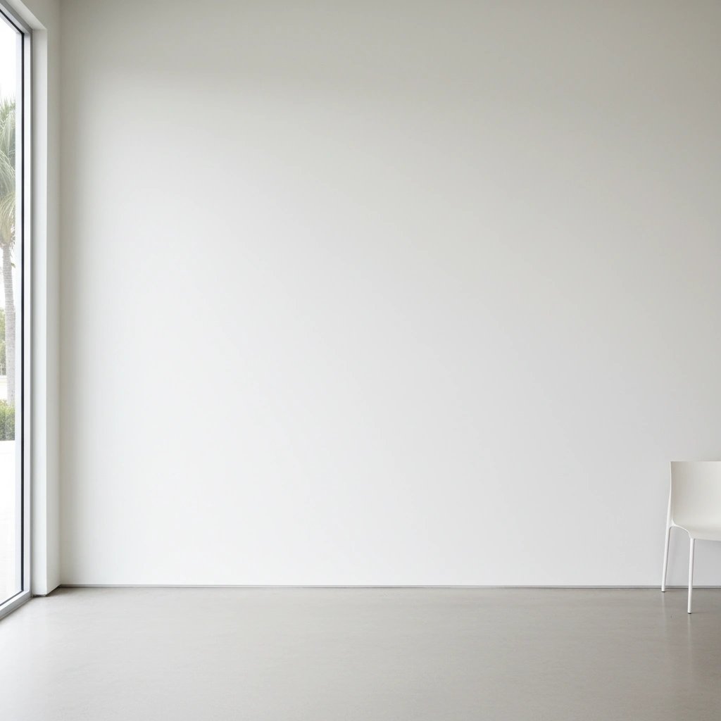 Wall art mockup: Minimalist gallery space with a white chair