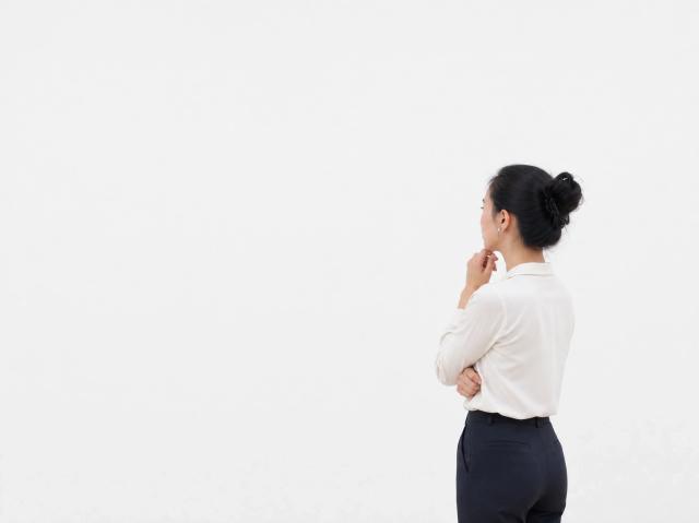 Minimalist gallery space with a thoughtful visitor