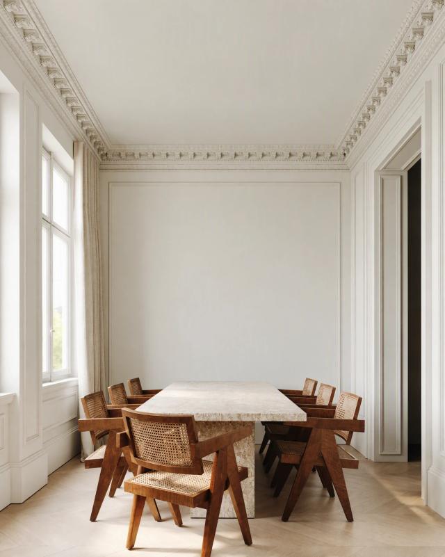 Grand dining room with a stone table and period mouldings
