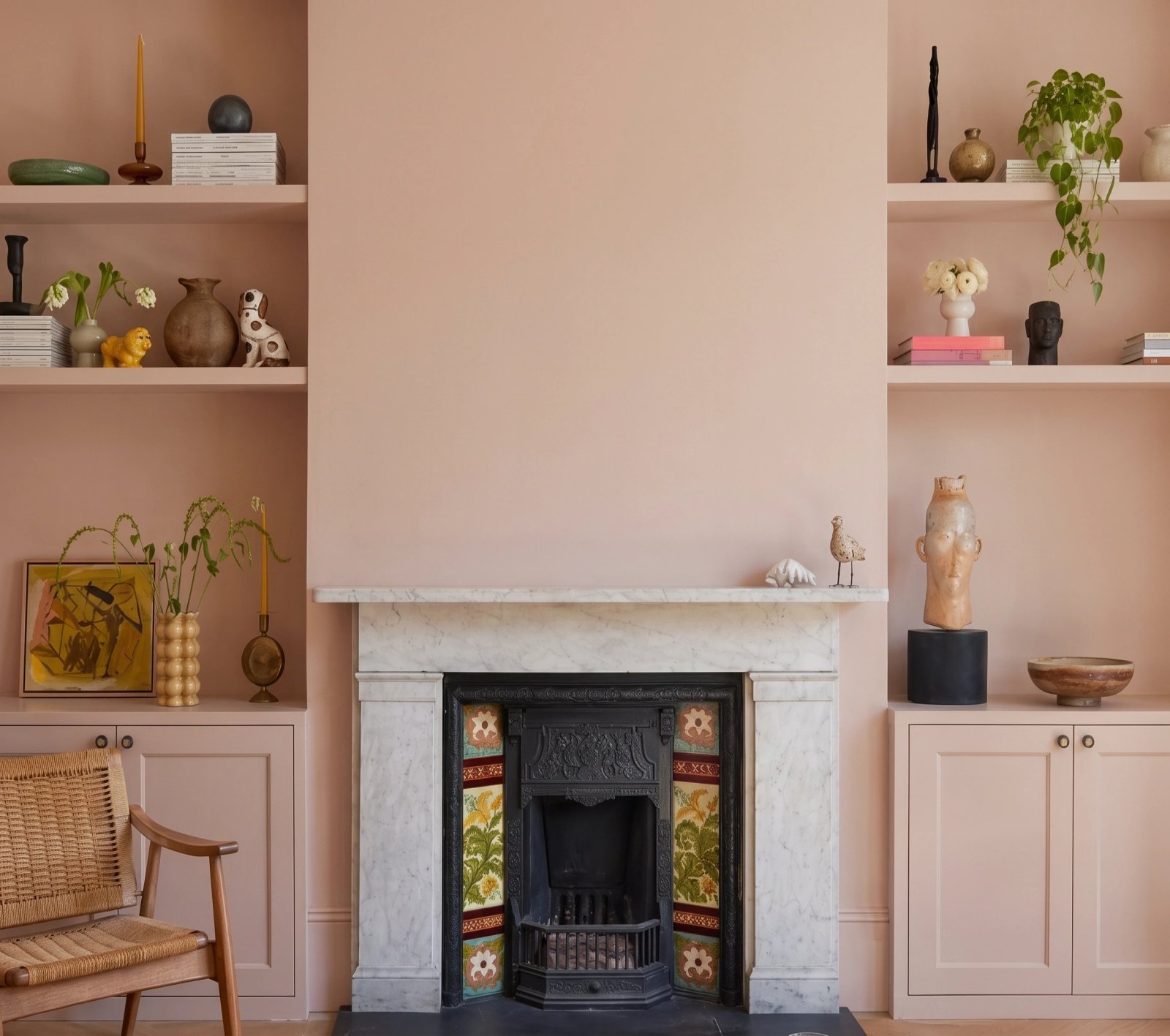 Wall art mockup: Eclectic living room with a fireplace and built-in cabinetry, with a cabinet