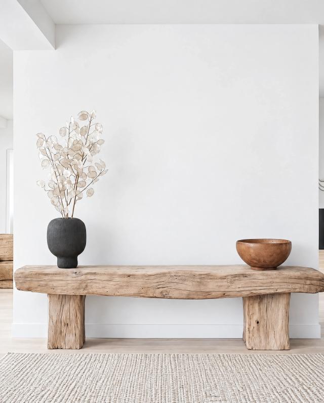 Contemporary hallway with a wooden bench and natural decor