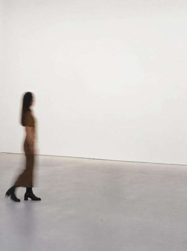 Two sample paintings hung together in White-walled gallery with a polished concrete floor